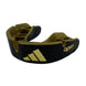 adidas tandskydd i svart och guld